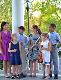Children holding musical instruments